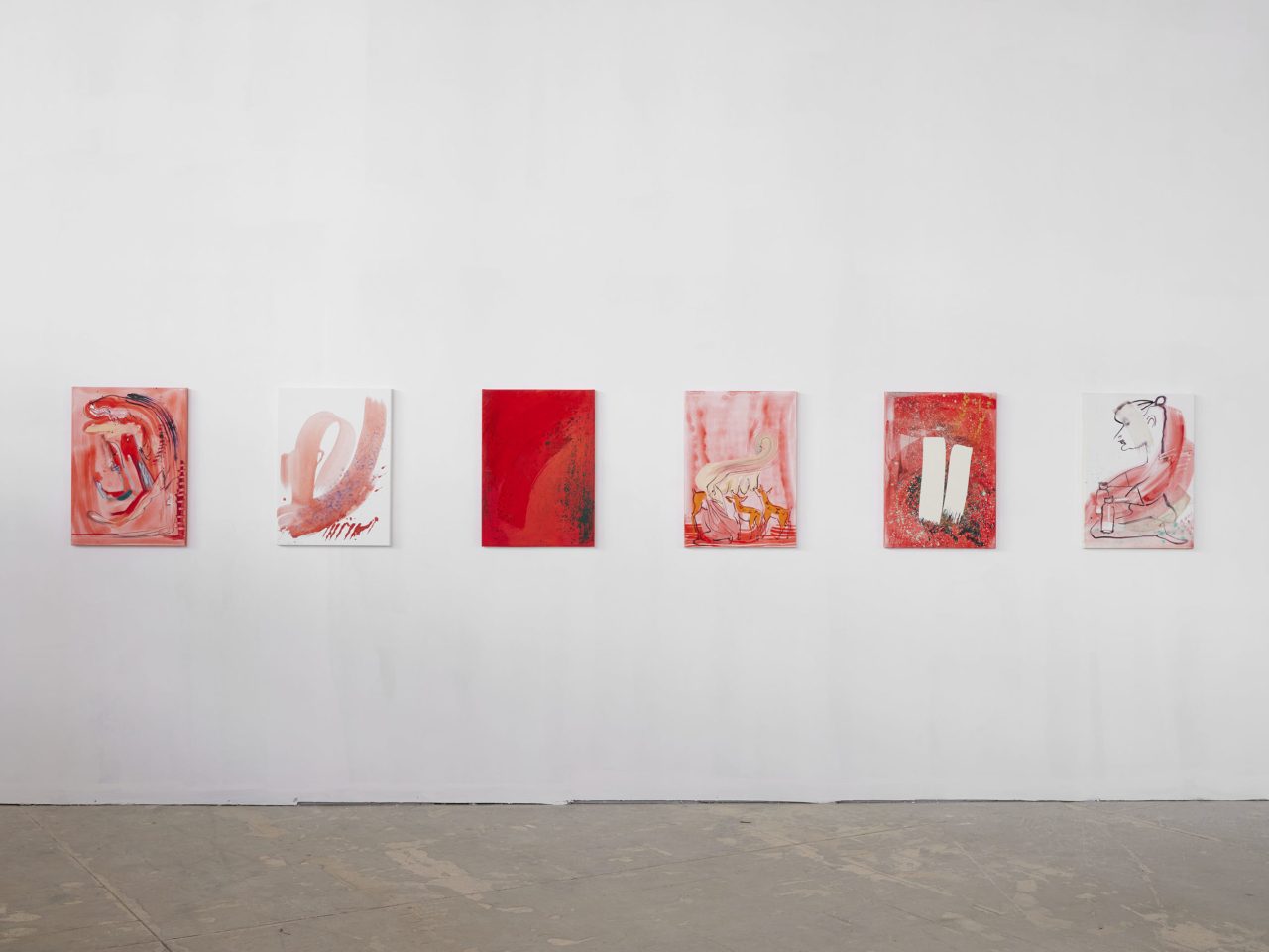 Six artworks on a wall, all using red paint. They are all abstract with different amounts of deepness in colour and white space.