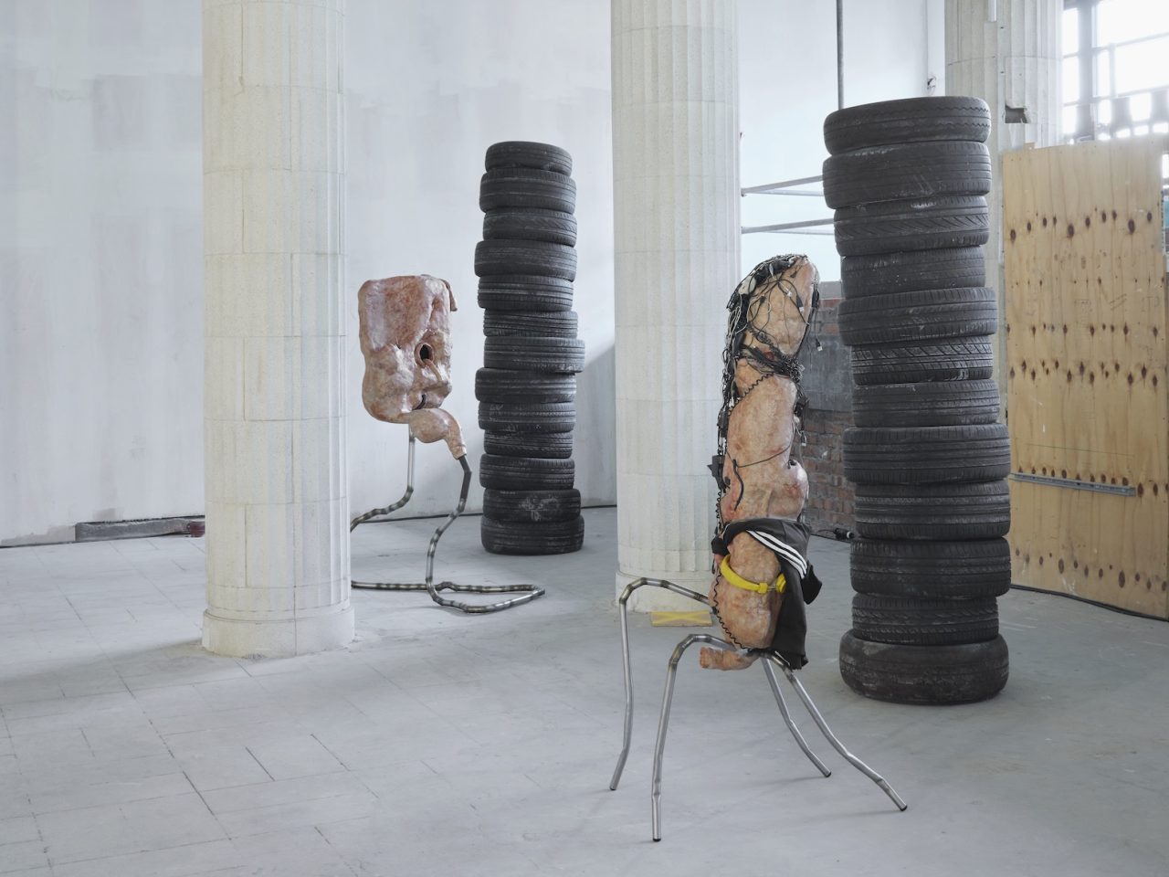 Mixed media sculptures made up of discarded objects, mostly car parts, and organic matter such as bioplastics. They resemble living bodily systems in their normal day-to-day functions. There are also stacks of used typres in the space
