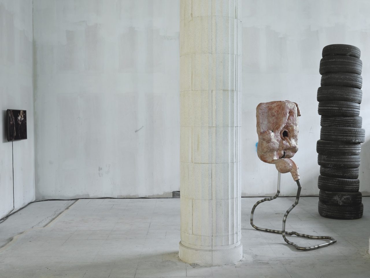 Mixed media sculptures made up of discarded objects, mostly car parts, and organic matter such as bioplastics. They resemble living bodily systems in their normal day-to-day functions. There are also stacks of used typres in the space