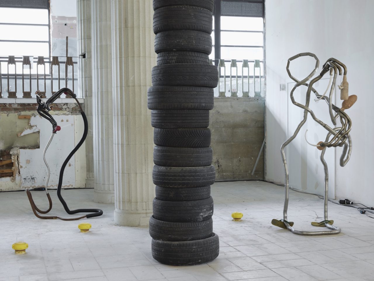 Mixed media sculptures made up of discarded objects, mostly car parts, and organic matter such as bioplastics. They resemble living bodily systems in their normal day-to-day functions. There are also stacks of used typres in the space
