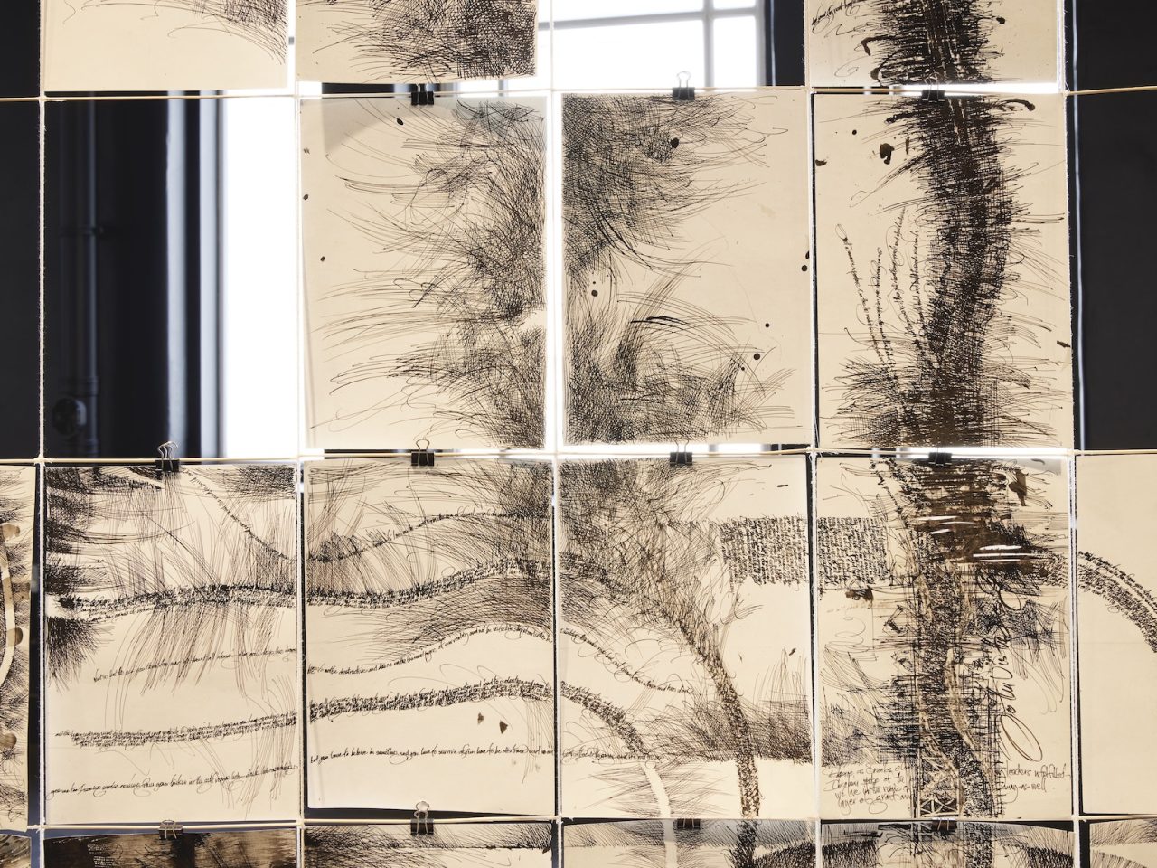 Drawings and writing in black ink on A4 paper. The papers are clipped together creating one larger artwork.